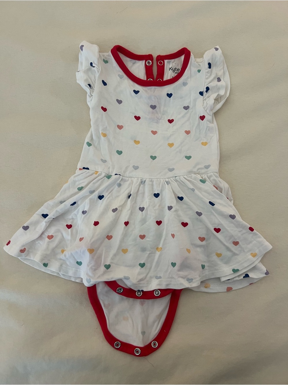 Kyte BABY White Dress Bodysuit with Multicolor Hearts and Red Trim